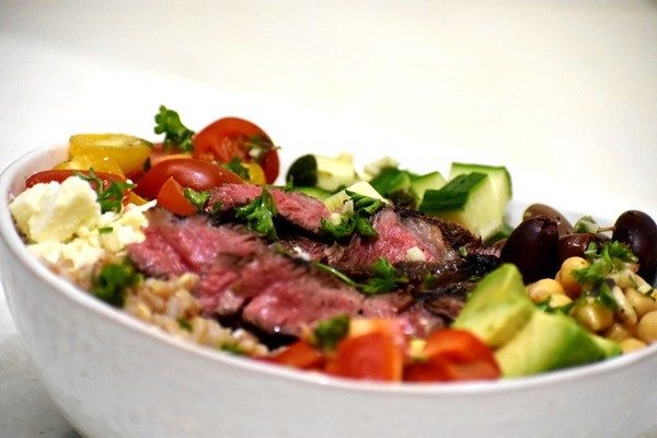 greek steak salad bowl viewed from side