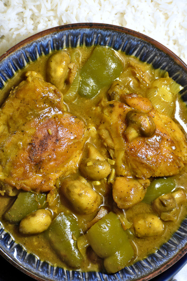 close up of a blue bowl full of south african chicken curry