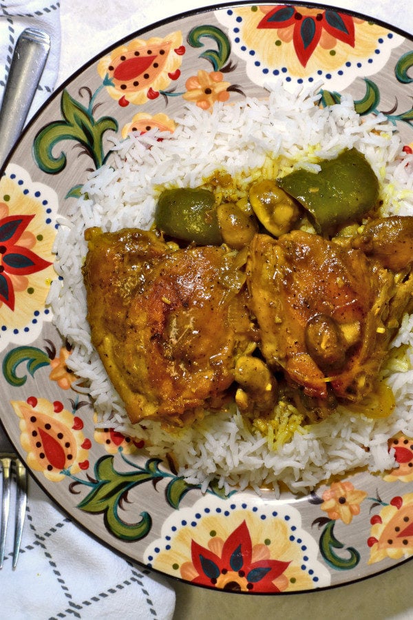 south african chicken curry atop a bed of rice on the gypsy plate